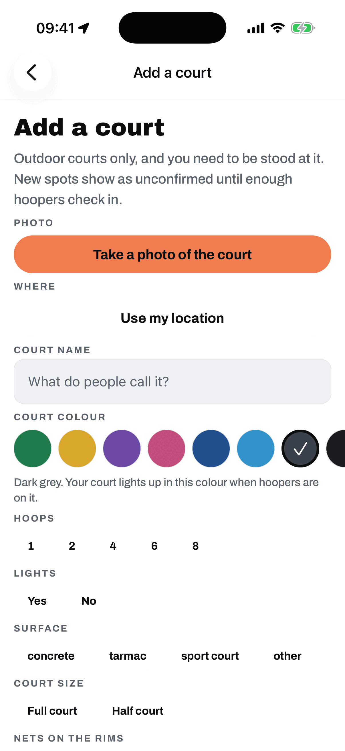 The Add a court screen: outdoor courts only and you need to be stood at it, with a Take a photo of the court button, Use my location, a court name field, and questions for hoops, lights, surface, court size, nets on the rims, and free and open to the public.